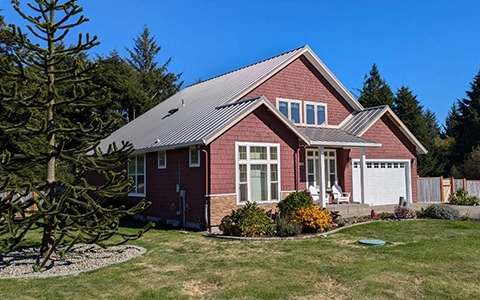 The Ilwaco Residence in Ilwaco, WA featuring ASC Building Products' Skyline Roofing® in Old Zinc Gray