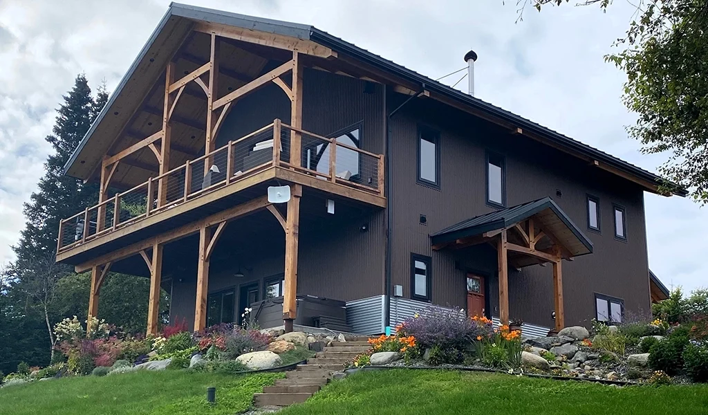 This residential home in Homer, AK features AEP Span's Nu-Wave Corrugated® in Natural Matte & ZINCALUME® siding colors.