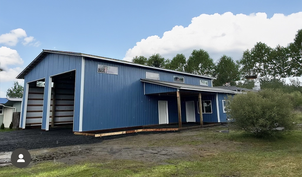 Residential Shop with Office in Westport. WA featuring ASC Building Products' Nor-Clad® Metal Siding in a Tahoe Blue with Winter White Trim.