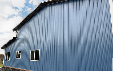 Residential Shop with Office in Westport. WA featuring ASC Building Products' Nor-Clad® Metal Siding in a Tahoe Blue with Winter White Trim.